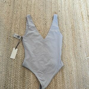 Aritzia blue bodysuit.